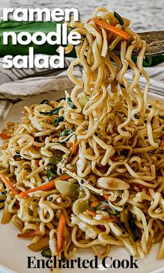 a white plate topped with noodles and vegetables