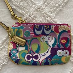 Poppy Pop Coach Wristlet - Never Used Before Gold Wristlet And Gold Hardware Throughout 4 Inches In Height And 6.5 Inches In Length No Signs Of Staining - Packaged In A Smoke Free Home Coach Multicolor Wristlet For Travel, Coach Multicolor Travel Wristlet, Multicolor Coach Wristlet For Travel, Coach Multicolor Pouch Wristlet, Coach Multicolor Wristlet For Everyday, Coach Multicolor Wristlet, Multicolor Coach Wristlet For Daily Use, Multicolor Wristlet With Zipper Closure As Gift, Coach Clutch