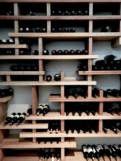 a wine cellar filled with lots of bottles