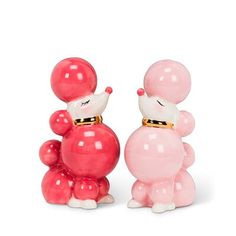 two small pink and white balloons shaped like animals, one holding the other's head