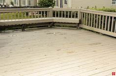 a wooden deck with two benches on it