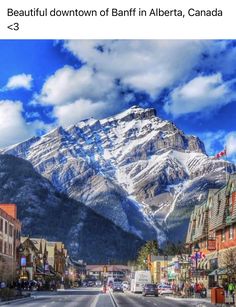 the town of banff in alberta, canada is surrounded by mountains