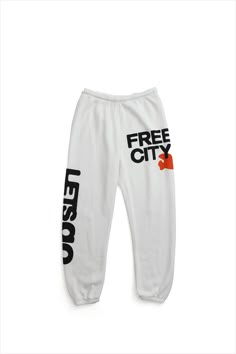 Unisex sweatpant with classic "Free City" print in black and yellow. A supersoft essential sweatpant with a covered elastic waist and a pull drawstring. WHY WE LOVE IT FREECITY, born in 2001, uses local factories with custom developed materials, fabrications, washes and dyes. Prints are hand-thrown, using hand-mixed paint with on-screen mixed gradients - made one by one, in small batches. DETAILS Medium weight polyblend: 50% rayon, 25% polyester, 25% cotton. Hand-sewn, washed, and hand-screen pr Free City Sweats, Free City Sweatpants, Graphic Sweatpants, Cute Sweatpants, Free City, Knit Shoes, Reference Pictures, City Print, Swag Outfits For Girls