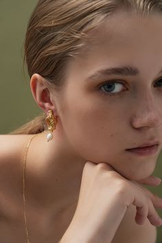 Pearls that drop with timeless elegance. Elegant Gold Plated Single Teardrop Earring, Feminine Drop Earrings For Pierced Ears, Feminine Evening Jewelry With Matching Earrings, Delicate Single Earring For Evening, Feminine Gold Plated Drop Earrings, Gold Pearl Earrings, Pearl Gemstone, Bridal Shop, Pearl Drop Earrings