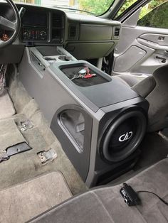 the inside of a vehicle with speakers and radio