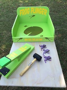 the frog finger game is set up on a picnic table