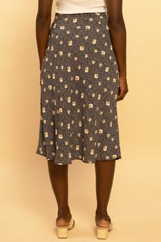 We are loving this fun & flirty midi skirt for any season! A pretty blue and beige floral print dances across this flattering, midi cut, woven fabric as it tumbles from a high waist. Pair this pretty piece with a distressed tee, knit, or a lacy cami for a perfect date-night ensemble! Hidden side zipper Lined 100% Polyester, 100% Rayon (lining) True to size Our model Nicole is wearing a size Small Blue Floral Midi Skirt, Distressed Tee, Perfect Date, Floral Midi Skirt, Blue Floral, Side Zipper, Business Casual, Woven Fabric, Date Night