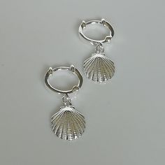 A PAIR of 12 mm sterling silver hoops. Comes with a sea shell charm. Dimensions: Hoops: 12 x 2 mm Shell: 11 x 14 mm Weight: 2.5 gm Price is for ONE PAIR. These earrings are made of 925 hypoallergenic sterling silver. Most of my pieces come with a 925 stamp. Can be packaged in a gift box. I can include a personal message from you if needed You are welcome to contact me at... bhavnakwintra1956@gmail.com For more beautiful pieces from my shop, please browse 👇 TOE RINGS: https://www.etsy.com/your/s Hoops Silver, Accessories Silver, Silver Accessories, Sterling Silver Hoops, A Sea, Toe Rings, Sea Shell, Silver Hoops, Bohemian Jewelry