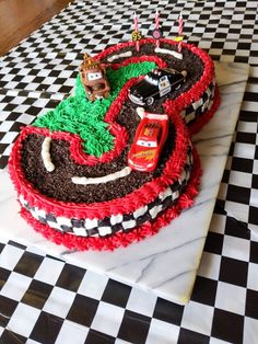 a birthday cake made to look like a race track