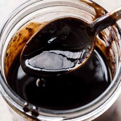 a glass jar filled with liquid on top of a table