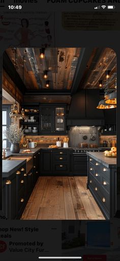 a kitchen with wooden floors and black cabinets