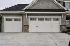 a house with two garage doors on each side