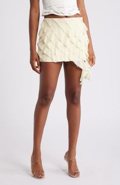 Frothy side ruffles add a sweet, sophisticated flourish to a fluttery tiered miniskirt made from crinkled georgette in a off-white shade. Back zip closure Lined 100% polyester Dry clean Imported Chic Mini Skirt With Layered Hem, Tiered Ruffle Mini Skirt For Party, Flirty Tiered Ruffled Mini Skirt, Flirty Tiered Ruffle Mini Skirt, Party Tiered Mini Skirt With Ruffles, Party Tiered Ruffle Mini Skirt, Party Mini Tiered Skirt With Ruffles, Party Mini Tiered Ruffle Skirt, Chic Tiered Ruffled Mini Skirt