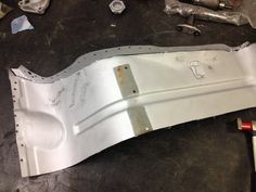 the front bumper is being worked on by someone who has been working on something else