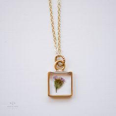 Our classic small square frame is available now with Yarrow flower botanicals! Necklace is gold plated brass, 24k gold plated finished on a gold 18" chain. Yarrow is a symbol of healing. Ships in gift worthy packaging. The symbolism of the botanical is printed on a tag included with your jewelry. Gold Rectangular Jewelry With Birth Flower, Gold Rectangular Birth Flower Jewelry, Gold Rectangular Jewelry For Mom, Rectangular Gold Jewelry Gift For Mom, Rectangular Gold Jewelry As Gift For Mom, Gold Rectangular Necklace As Gift For Mom, Rectangular Gold Necklace As Gift For Mom, Gold Rectangular Necklace For Mom, Handmade Gold Charm Necklace With Square Pendant