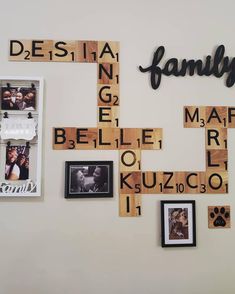 scrabble tiles are arranged on the wall with family pictures and words above them