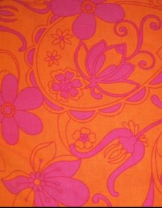 an orange and pink background with flowers and swirls on it's surface,