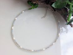 Gray Choker with 3mm beads. Faceted Czech Crystal and White River Pearl beads. MEASURES 35, 40, 45, 50, 55 and 60 cm. + 5cm extender.  There is the possibility of removing the extender in case you do not want it. Contact me to detail your request  💎M A T E R I A L S - 3mm gray glass beads.   The stones are natural so they will never be the same as each other. - White river pearls. - Stainless steel closures. - Unbreakable steel thread for linking beads. 📦PACKAGING Very nice packaging ready to give away if desired. - Navy blue box with the logo (measured according to the size of the jewel). - Light brown natural linen burlap bag, VIP card with 15% discount,    wipe to clean the jewel and some delicious sweets. - Padded bag for protection during transport. 📦SHIPPING All products are shipp Silver Crystal Necklace With Tiny Beads As A Gift, Silver Choker With Faceted Beads For Gift, Gray Faceted Beads Necklace For Gifts, Beads Packaging, Summer Choker, Nice Packaging, White Choker, River Pearls, Vip Card