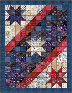 a blue quilt with red, white and blue stars on the top is shown in this image