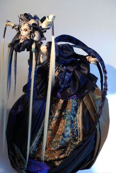 a woman with long white hair and blue eyes is dressed in an elaborate dress, holding two swords