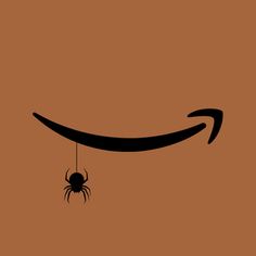 an amazon logo with a spider hanging from it's side on a brown background