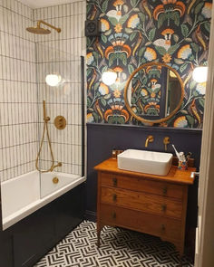 A carousel of images of a bathroom that has an upcycled wooden cabinet for the sink, patterned floor tiles, rustic wall tiles and floral wallpaper. Small Toilet Room Art Deco, Bathroom Cabinet Sink, Upcycled Bathroom, Amber Hill, Upgrade Bathroom, Craftsman Style Interior, Hotel Style Bathroom, Bathroom Sink Cabinet