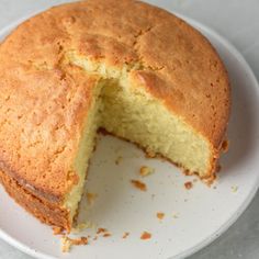 a white plate topped with a cake cut in half