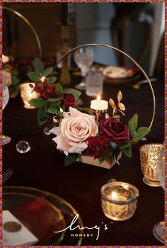 a table with candles and flowers on it