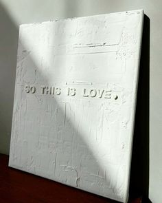 a white block with the words 30 this is love written on it