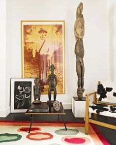 a living room filled with furniture and art