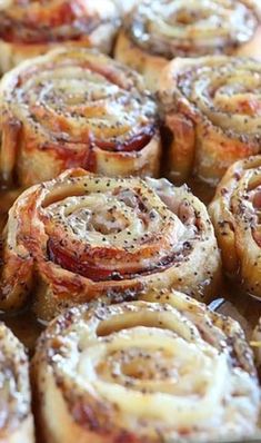 some cinnamon rolls sitting on top of a pan