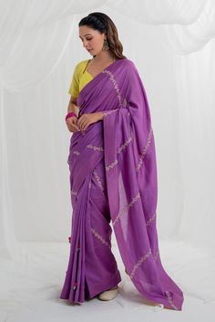 Purple chanderi saree with floral resham and 3D embroidery. Paired with a yellow short sleeve blouse. 
Components: 2
Pattern: Embroidered
Type Of Work: Hand and machine embroidery
Fabric: Chanderi
Color: Purple
Other Details: 
Floral and 3D embroidery
Back tie-up blouse
Occasion: Mehendi and Haldi - Aza Fashions Festive Floral Embroidered Raw Silk Pre-draped Saree, Transitional Pre-draped Saree With Floral Embroidery, Festival Cotton Silk Pre-draped Saree With Dori Work, Navratri Cotton Silk Pre-draped Saree With Resham Embroidery, Designer Embroidered Cotton Silk Pre-draped Saree, Festive Embroidered Slub Silk Pre-draped Saree, Bollywood Style Pre-draped Saree With Floral Embroidery, Unstitched Purple Pre-draped Saree With Dori Work, Designer Pre-draped Saree With Floral Embroidery