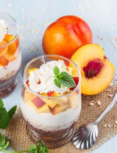 two desserts with fruit and whipped cream are on the table next to each other