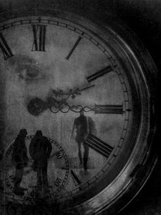 a black and white photo of people standing in front of a clock