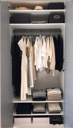 an organized closet with clothes and shoes