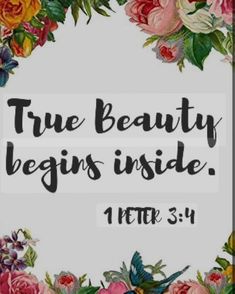 the words true beauty begins inside are surrounded by flowers