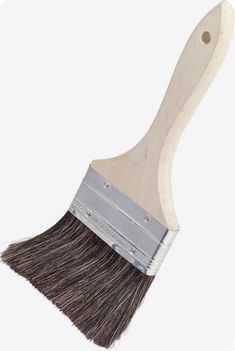 a paint brush with a wooden handle on a white background