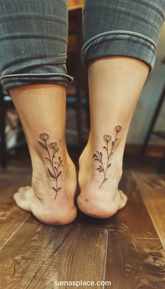 two feet with small flowers on them