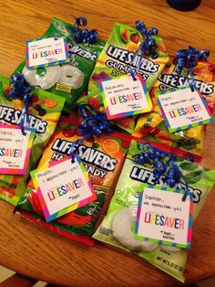 a pile of life savers candy sitting on top of a wooden table