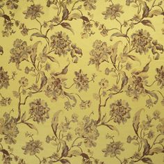 a yellow floral wallpaper with brown and white flowers on the bottom half of it