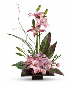 an arrangement of pink flowers and greenery in a black vase on a white background