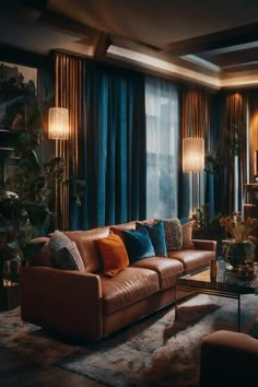 a living room filled with lots of furniture next to a window covered in blue curtains