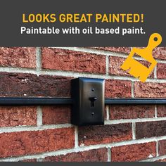 a brick wall with a black metal handle on it that says looks great painted paintable with oil based paint