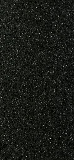 water drops on the surface of black material