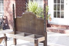 an old bed frame is being used as a planter