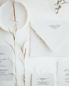 the wedding stationery is laid out and ready to be put into their guests'envelopes