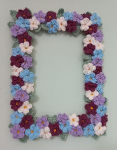 a crocheted letter made up of flowers