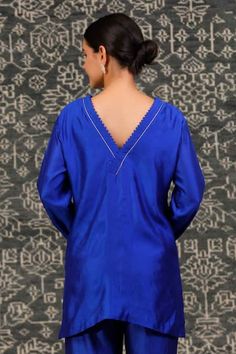 Buy Blue Chiniya Silk Embroidered Zardosi Noor Sleeve Short Kurta And Flared Pant Set For Women by Eeda Online at Aza Fashions. Festive Dabka Embellished Tops, Unstitched Traditional Blue Top, Blue Straight Kurta Tops For Festive Occasions, Festive Blue Straight Kurta Top, Blue Fitted Straight Kurta Top, Festive Blue Straight Kurta, Fitted Blue V-neck Kurta, Blue Fitted V-neck Kurta, Elegant Blue V-neck Kurta