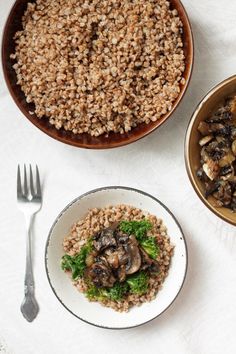 two bowls filled with mushrooms and rice next to a bowl of broccoli on a table