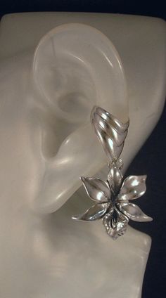 Silver Orchid Ear Cuff Chevron by martymagic on Etsy, $65.00 Big Unique Earrings, Eyeliner Glitter, Flower Ear Cuffs, Ear Cuff Silver, Orchid Jewelry, Silver Flower Earrings, Earring Dangle, Flower Ear, Wrap Earrings